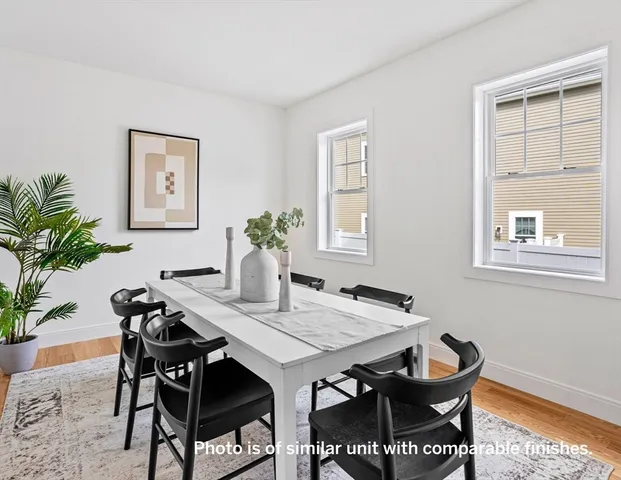 a view of a dining room with furniture and window