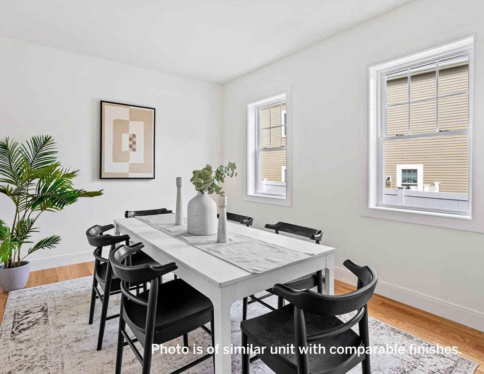 75 Franklin Street, Unit 1 Arlington, MA 02474 - Photo 18 of 36 a view of a dining room with furniture and window