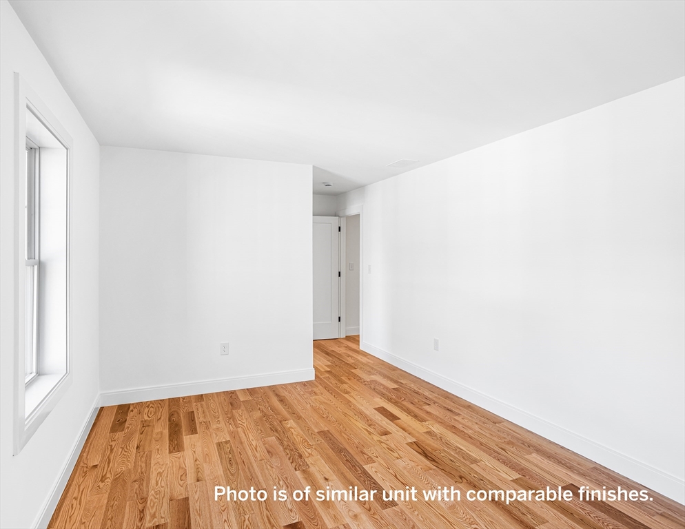 75 Franklin Street, Unit 1 Arlington, MA 02474 - Photo 27 of 36 a view of an empty room and window