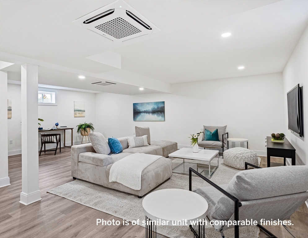 75 Franklin Street, Unit 1 Arlington, MA 02474 - Photo 32 of 36 a living room with furniture