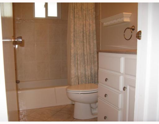 2487 Rose Garden Road Pittsburgh, PA 15220 - Photo 11 of 13 Other. Bath-remodeled in 2004. Beige ceramic tile floor and walls, white vanity sink, white tub and toilet.