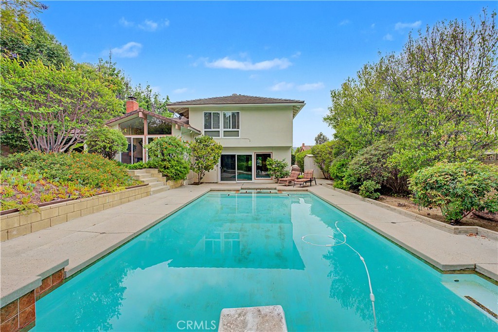22671 Town Crier Road Calabasas, CA 91302 - Photo 12 of 35 a view of house with swimming pool outdoor seating