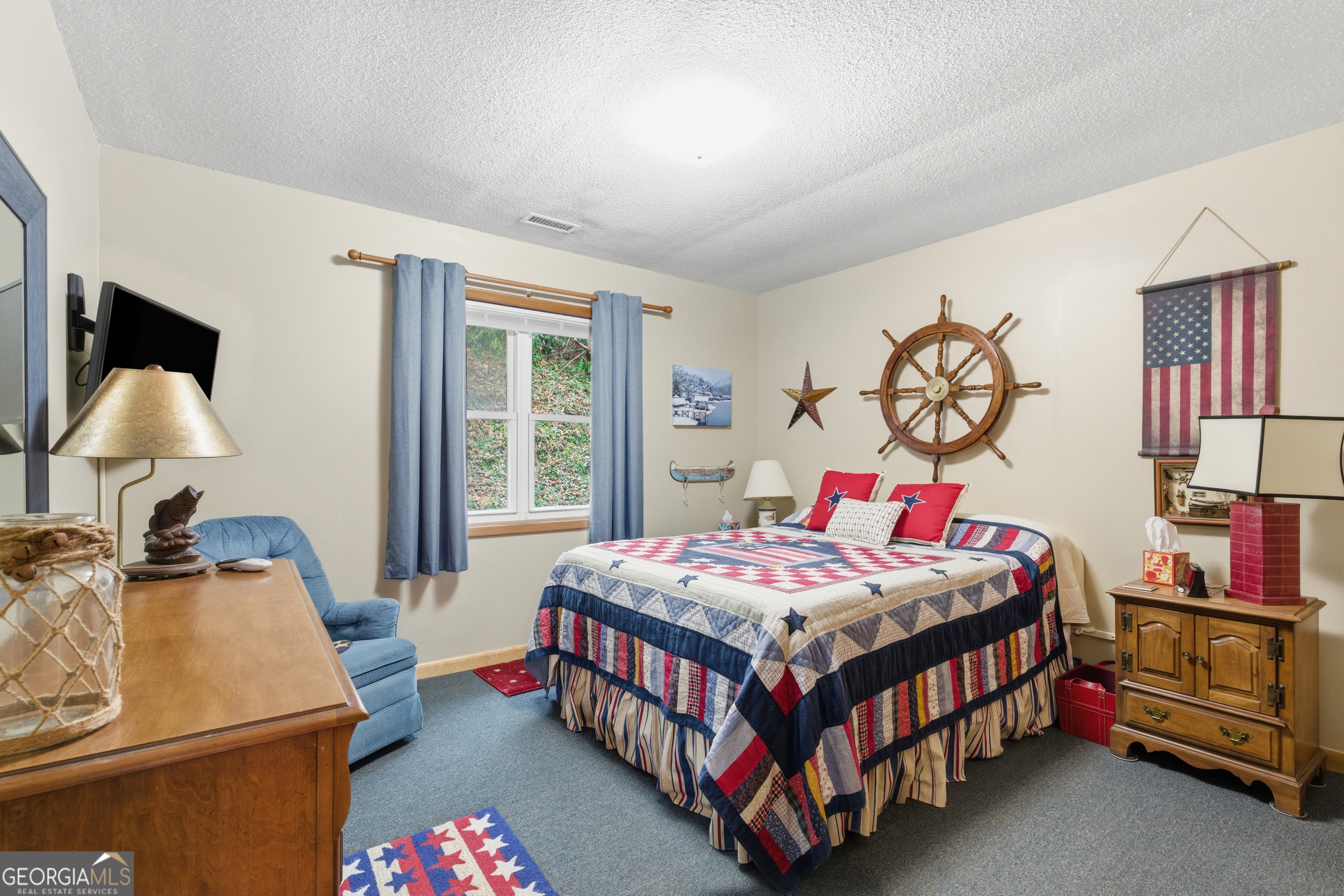 620 Timpson Cove Road Clayton, GA 30525 - Photo 13 of 32 a bedroom with a bed and a table