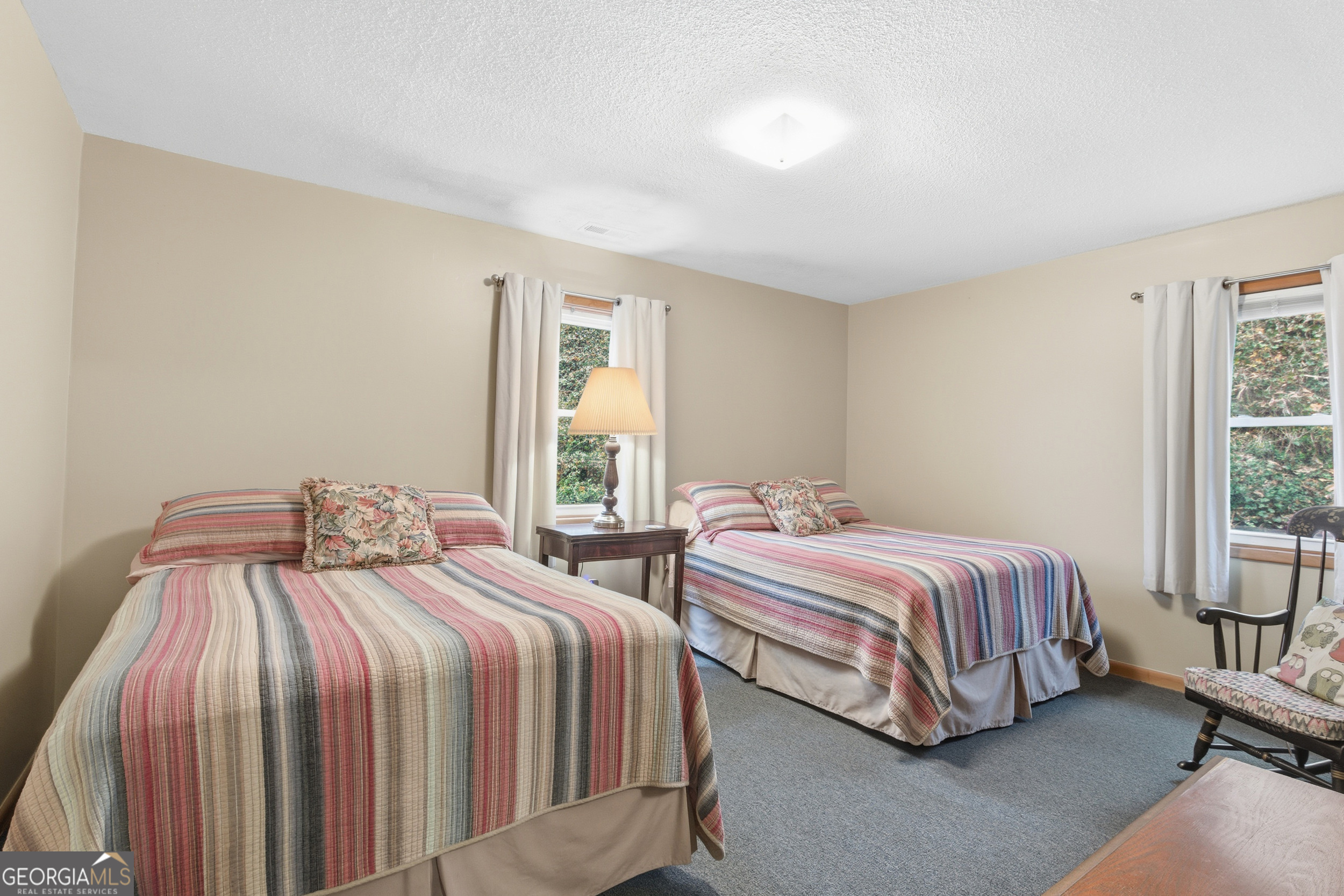 620 Timpson Cove Road Clayton, GA 30525 - Photo 16 of 32 a bedroom with two beds and window