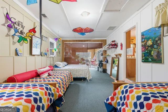 a bedroom with bed and a window