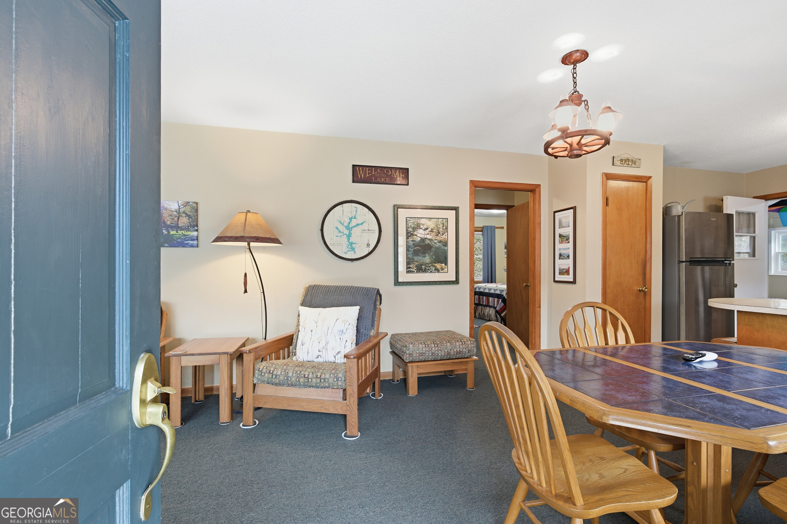 620 Timpson Cove Road Clayton, GA 30525 - Photo 8 of 32 a view of a dining room with furniture and a chandelier