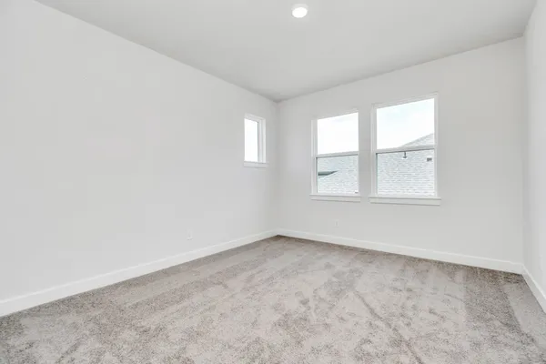 a view of an empty room with closet