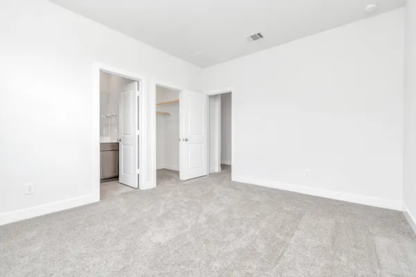 a view of a living room with furniture and a rug