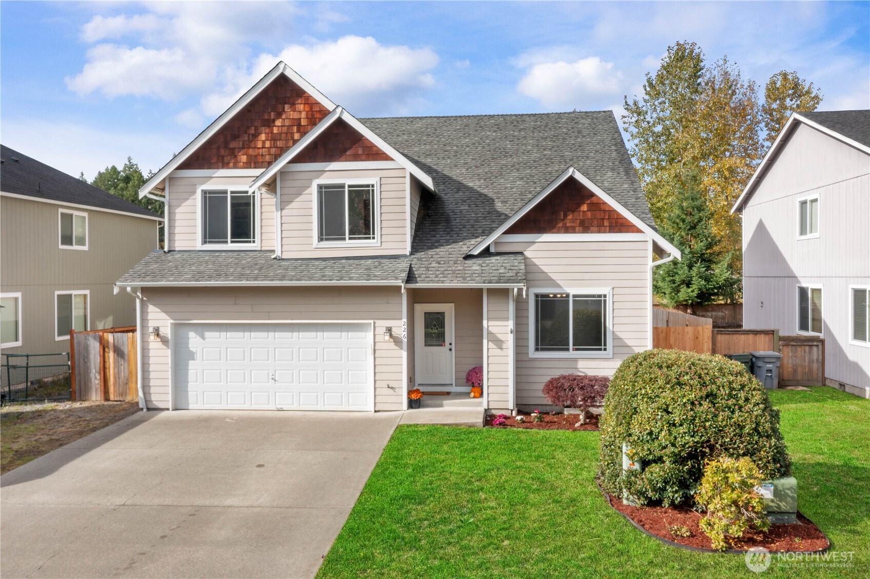 a front view of a house with a garden and porch
