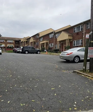 a front view of a house with parking space