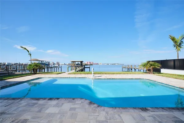 a view of a swimming pool and an outdoor space