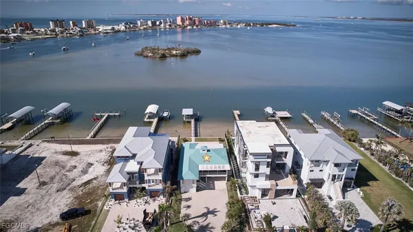an aerial view of a residential apartment building with outdoor space