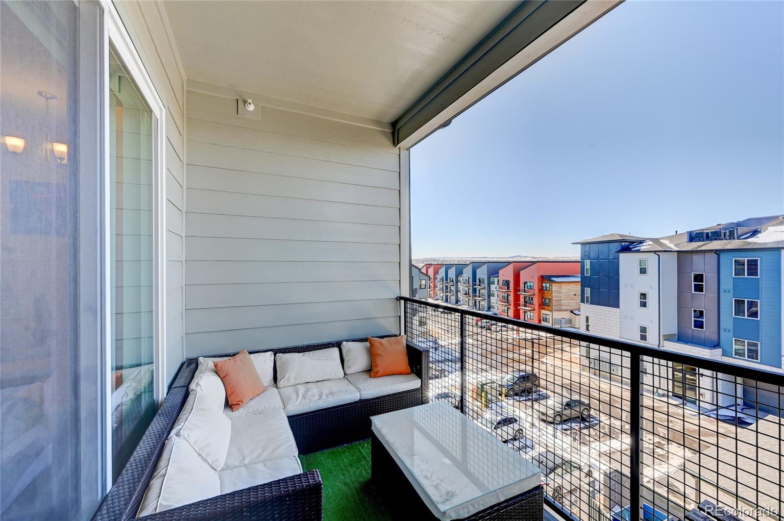 9287 Twenty Mile Road, Unit 405 Parker, CO 80134 - Photo 1 of 31 a view of a balcony with furniture