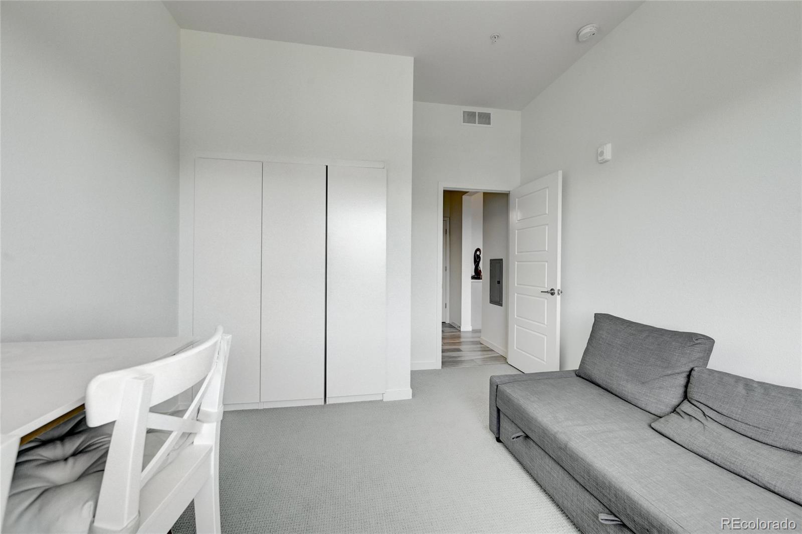9287 Twenty Mile Road, Unit 405 Parker, CO 80134 - Photo 20 of 31 a living room with furniture and a couch