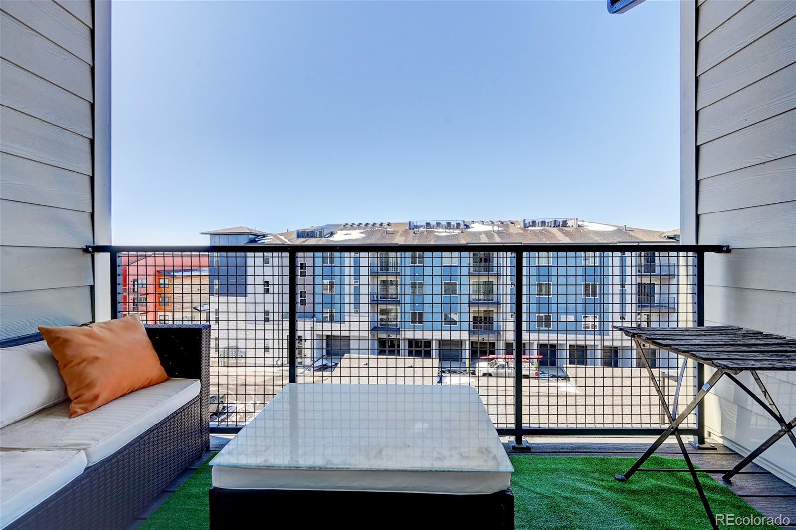 9287 Twenty Mile Road, Unit 405 Parker, CO 80134 - Photo 23 of 31 a balcony view with a couch