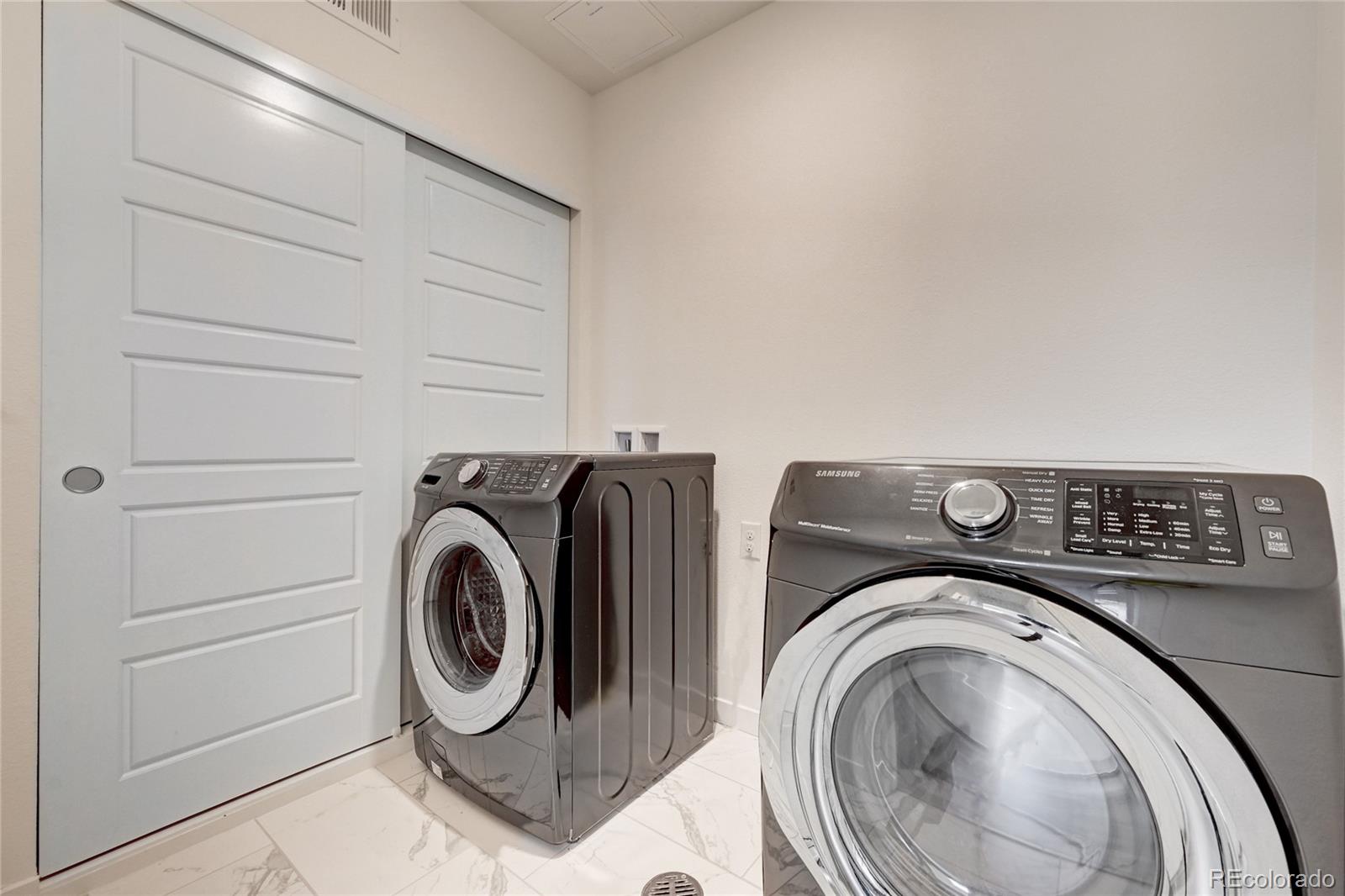 9287 Twenty Mile Road, Unit 405 Parker, CO 80134 - Photo 25 of 31 a utility room with dryer and washer