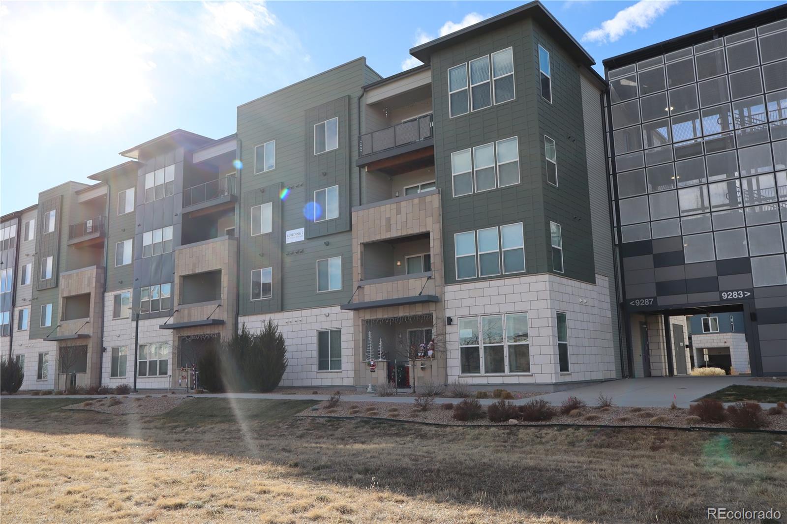 9287 Twenty Mile Road, Unit 405 Parker, CO 80134 - Photo 27 of 28 a front view of a building