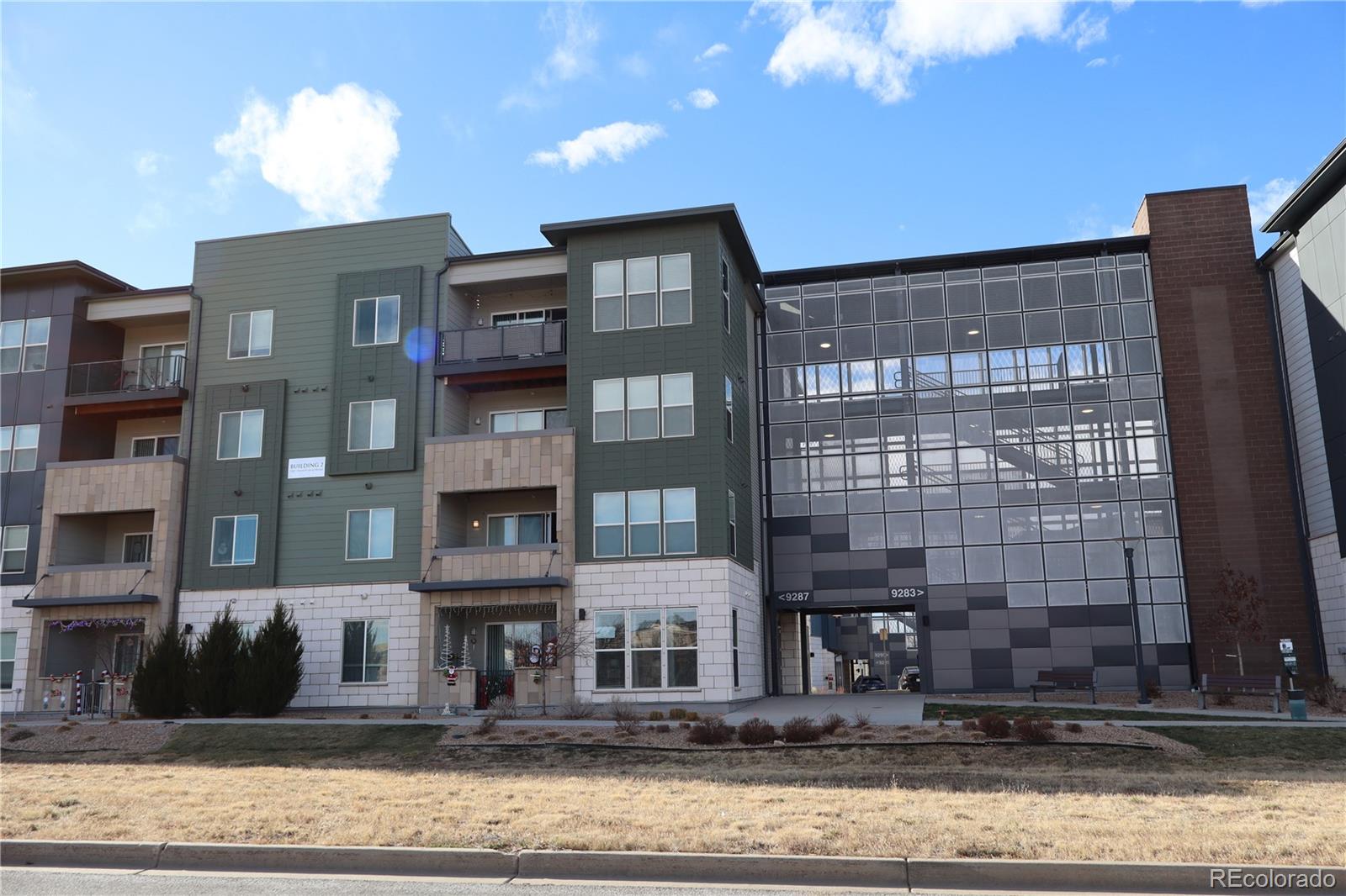 9287 Twenty Mile Road, Unit 405 Parker, CO 80134 - Photo 28 of 28 a front view of a building