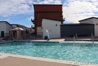 9287 Twenty Mile Road, Unit 405 Parker, CO 80134 - Photo 29 of 31 a house that has a backyard