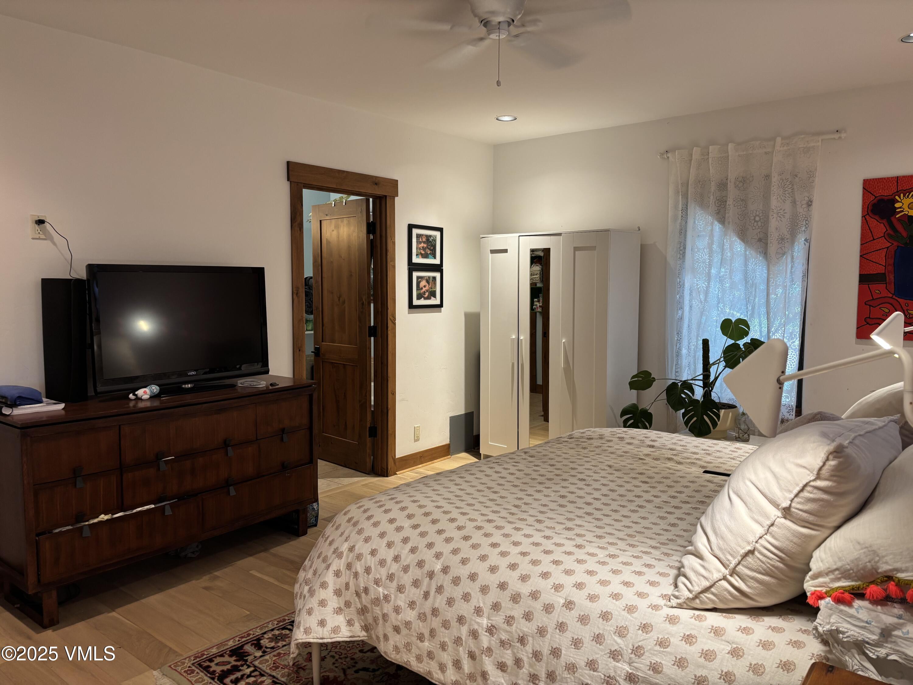 40 Bunker Way Eagle, CO 81631 - Photo 12 of 18 a bedroom with a flat screen television and a bed