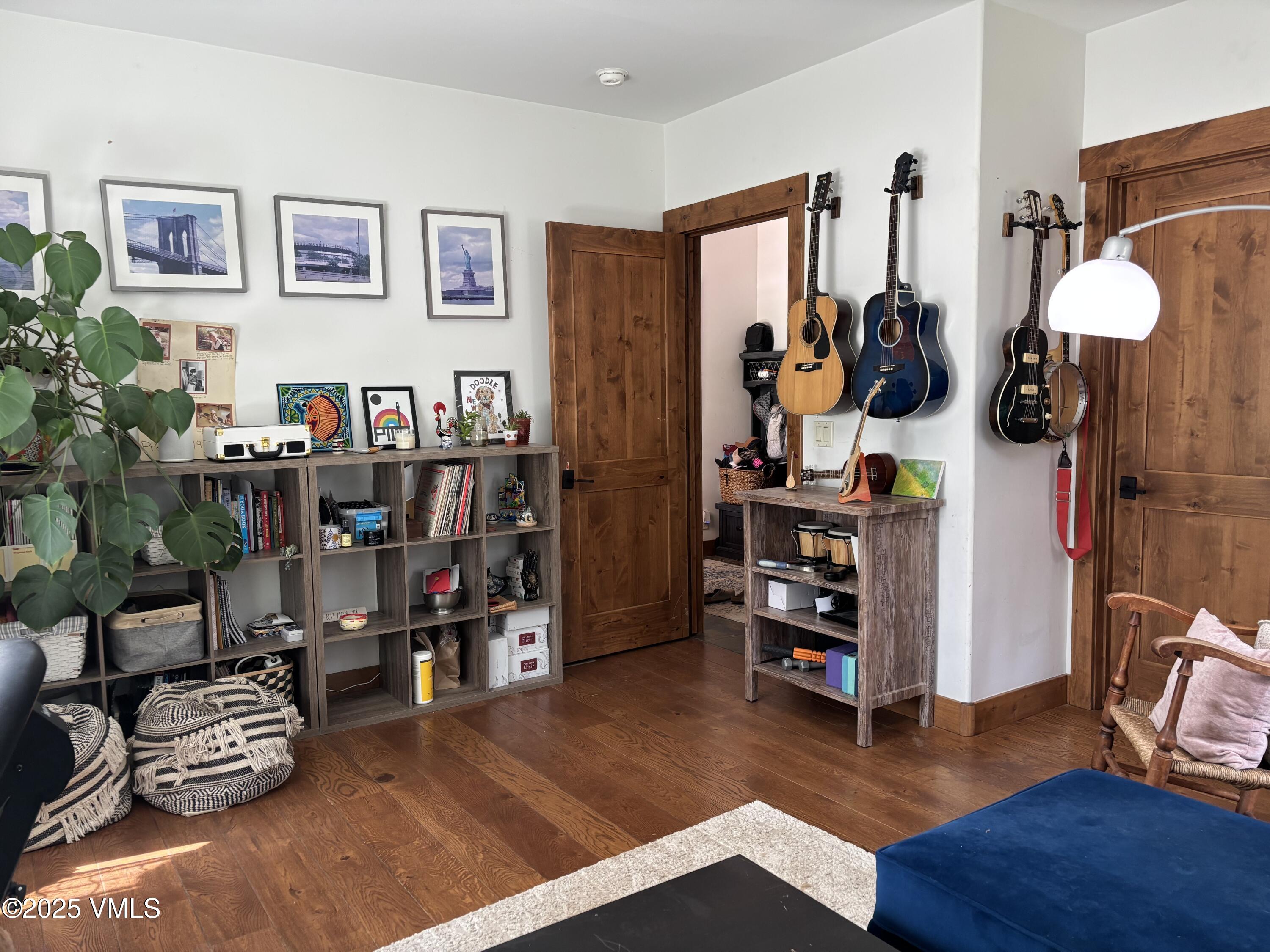 40 Bunker Way Eagle, CO 81631 - Photo 16 of 18 a room with furniture and wooden floor