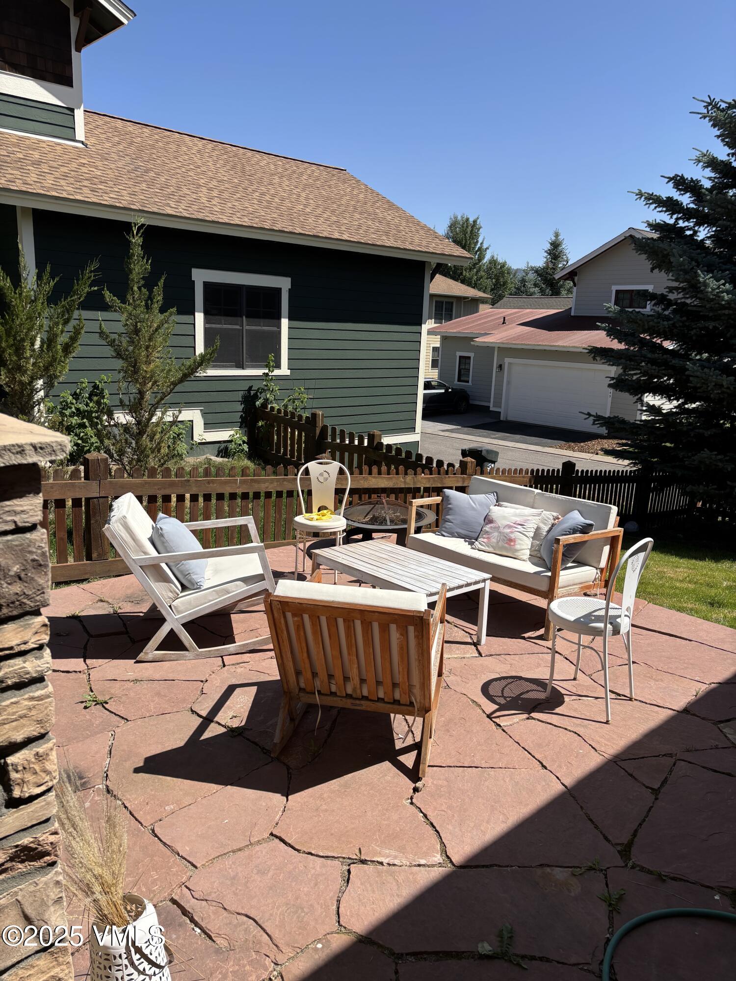 40 Bunker Way Eagle, CO 81631 - Photo 18 of 18 a view of a patio with table and chairs with wooden floor and fence