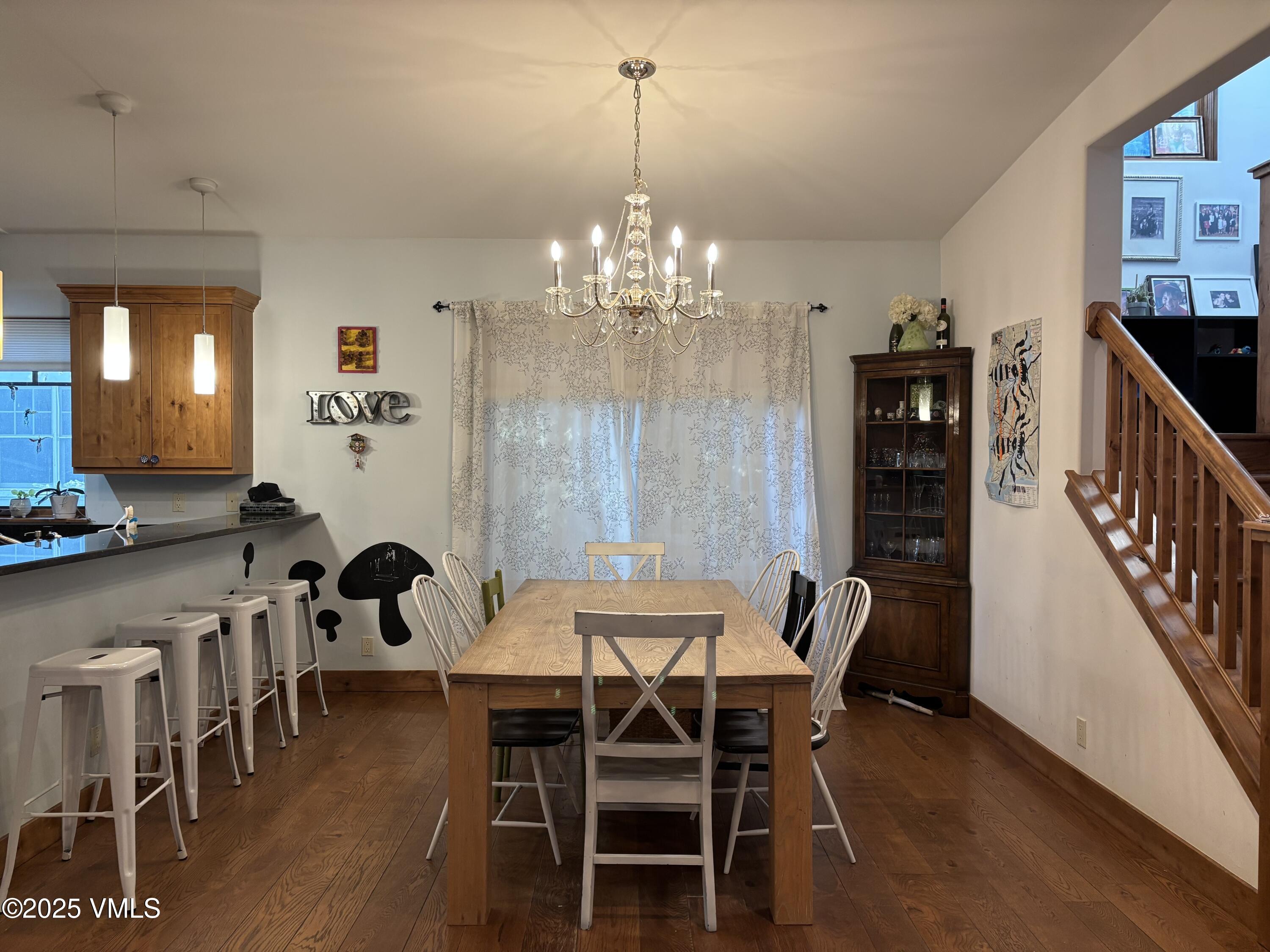 40 Bunker Way Eagle, CO 81631 - Photo 10 of 18 a view of a dining room with furniture and wooden floor