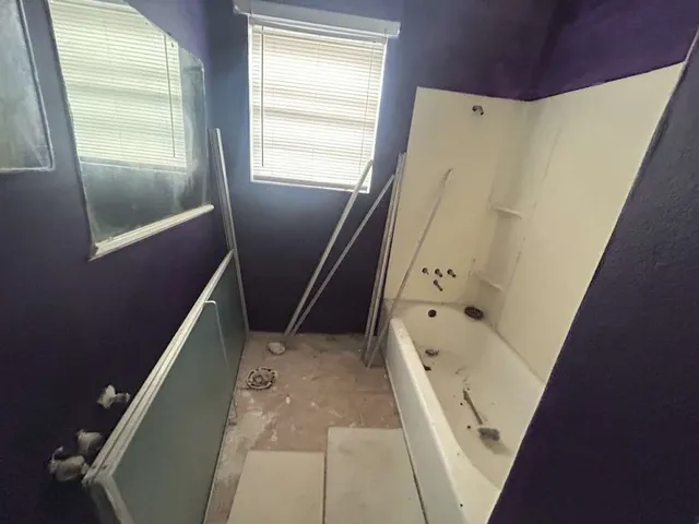 a view of a livingroom with furniture and staircase