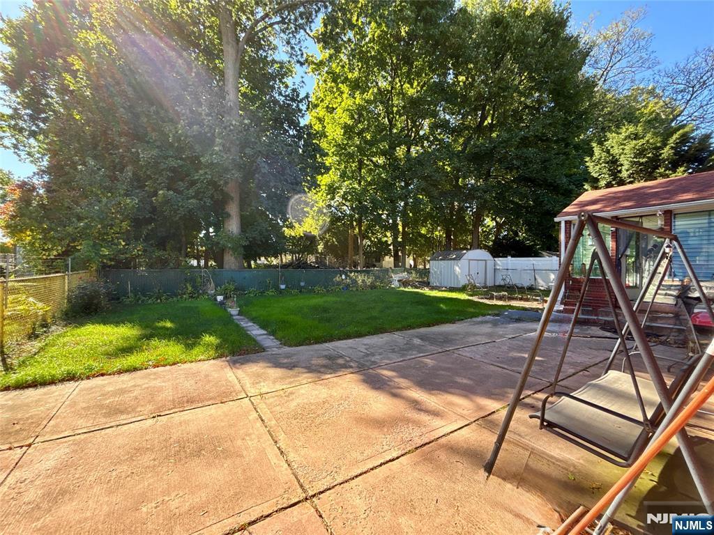 62 Howland Avenue Teaneck, NJ 07666 - Photo 13 of 14 a view of backyard with slide