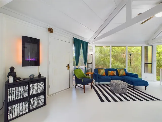 a living room with furniture and a window