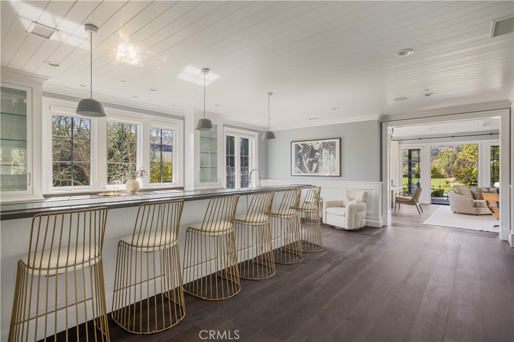 24200 Hidden Ridge Road Hidden Hills, CA 91302 - Photo 17 of 61 a living room with furniture and wooden floor