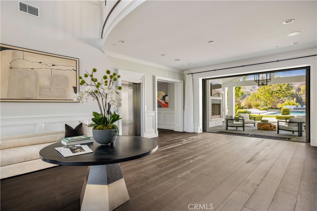 24200 Hidden Ridge Road Hidden Hills, CA 91302 - Photo 18 of 61 a living room with furniture and a large window