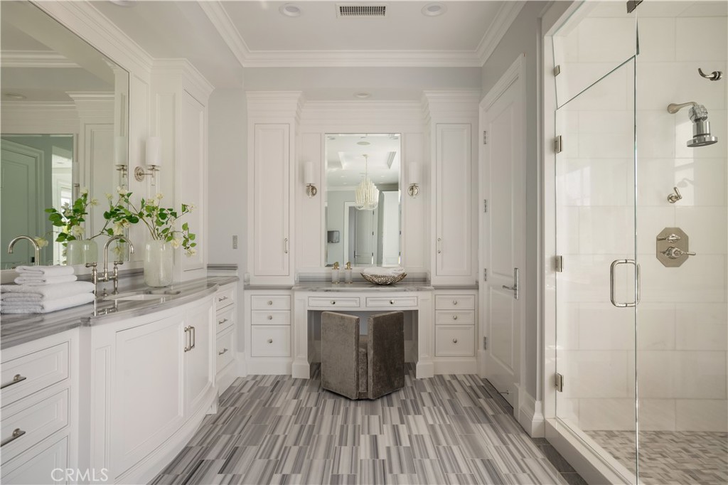 24200 Hidden Ridge Road Hidden Hills, CA 91302 - Photo 25 of 61 a bathroom with a sink and a mirror