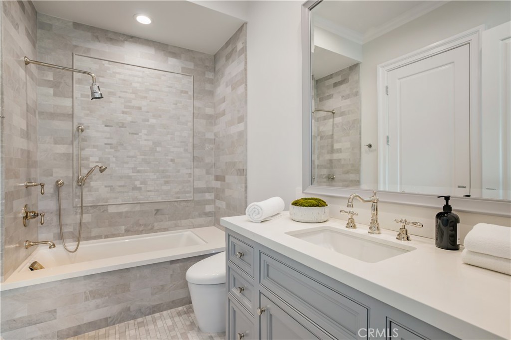 24200 Hidden Ridge Road Hidden Hills, CA 91302 - Photo 30 of 61 a bathroom with a sink and a mirror