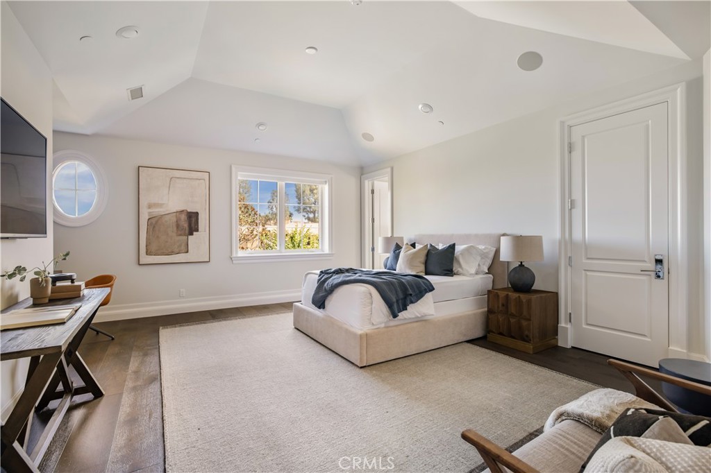24200 Hidden Ridge Road Hidden Hills, CA 91302 - Photo 31 of 61 a living room with furniture and painting on the wall
