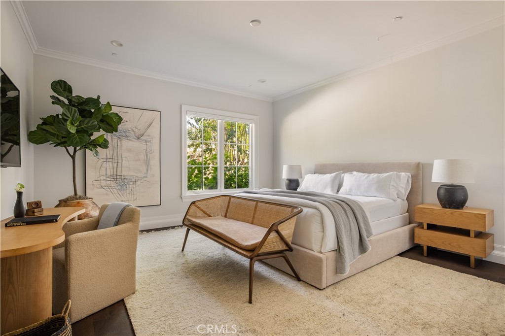 24200 Hidden Ridge Road Hidden Hills, CA 91302 - Photo 35 of 61 a spacious bedroom with a bed and a couch