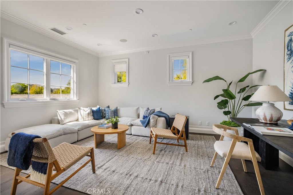 24200 Hidden Ridge Road Hidden Hills, CA 91302 - Photo 37 of 61 a living room with furniture and a potted plant