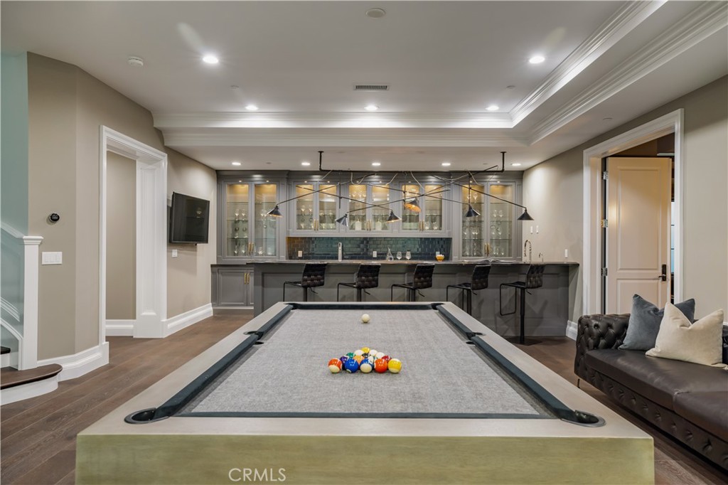 24200 Hidden Ridge Road Hidden Hills, CA 91302 - Photo 39 of 61 a living room with stainless steel appliances furniture wooden floor and a large window