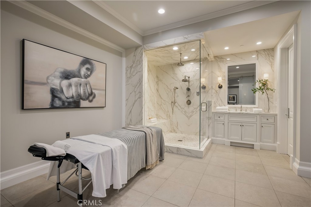 24200 Hidden Ridge Road Hidden Hills, CA 91302 - Photo 42 of 61 a spacious bathroom with a tub and shower