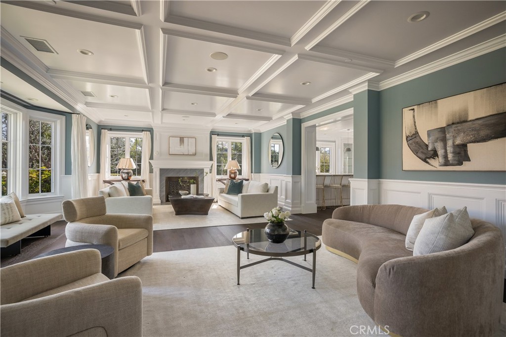 24200 Hidden Ridge Road Hidden Hills, CA 91302 - Photo 7 of 61 a living room with furniture fireplace and a chandelier