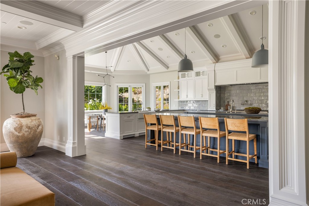 24200 Hidden Ridge Road Hidden Hills, CA 91302 - Photo 10 of 61 a dining room with furniture and wooden floor