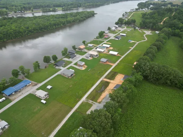 a view of a lake with a yard