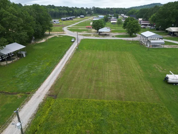 a view of a lake with a yard