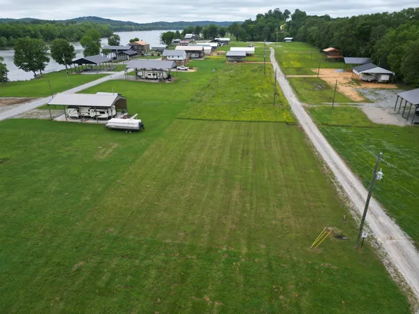 a view of a lake with a yard