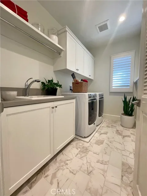 117 Appian Irvine, CA 92602 - Photo 15 of 19 a room with a sink and cabinets