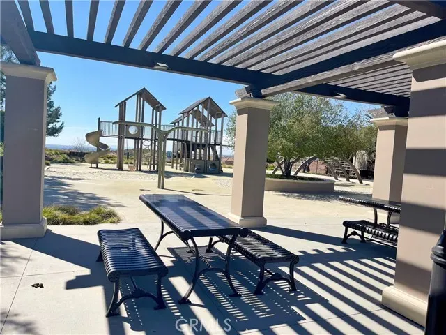 a view of a patio with wooden floor