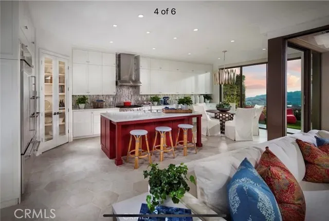 a living room with furniture a large window and a table