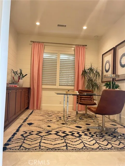 117 Appian Irvine, CA 92602 - Photo 5 of 19 a view of an empty room and kitchen with wooden floor
