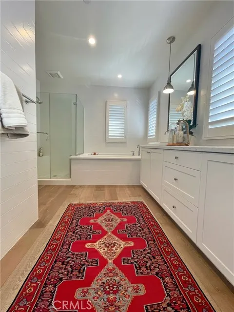 117 Appian Irvine, CA 92602 - Photo 9 of 19 a spacious bedroom with a bed and a mirror