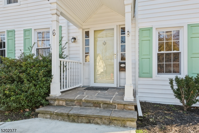 6 Hanover Road Florham Park, NJ 07932 - Photo 2 of 26 a front view of a house with a yard